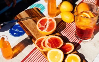 What are the differences between orange juice and grapefruit juice in terms of nutrition?